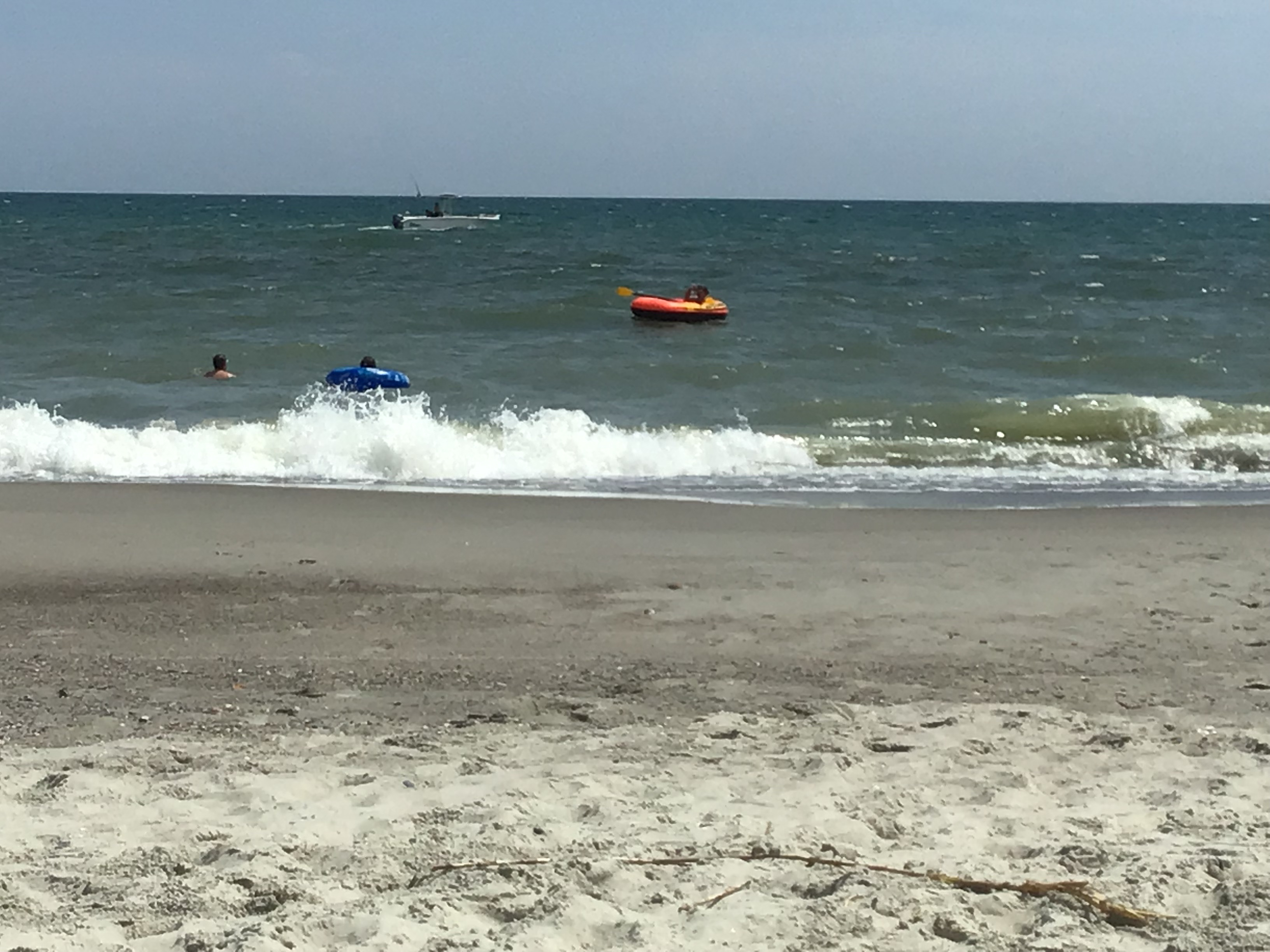 Jackson & Josh Curtis enjoy a boat and tubing at Oak Island NC        Location:  Sandpiper Cottage, Oak Island NC                                 Source:  Julane Crabtree                               Date: 25 Jul 2023