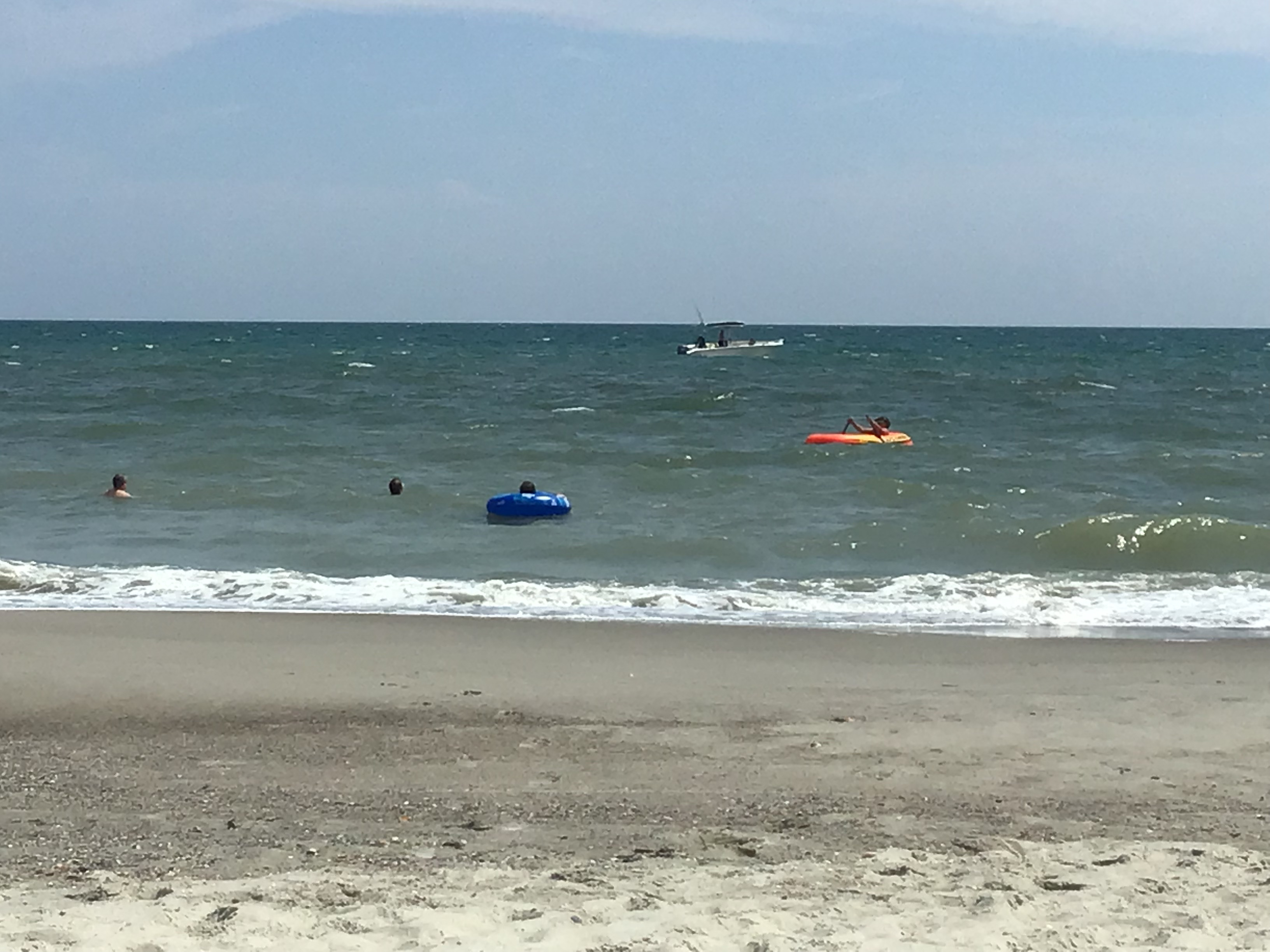 Jackson & Josh Curtis enjoy a boat and tubing at Oak Island NC        Location:  Sandpiper Cottage, Oak Island NC                                 Source:  Julane Crabtree                               Date: 25 Jul 2023