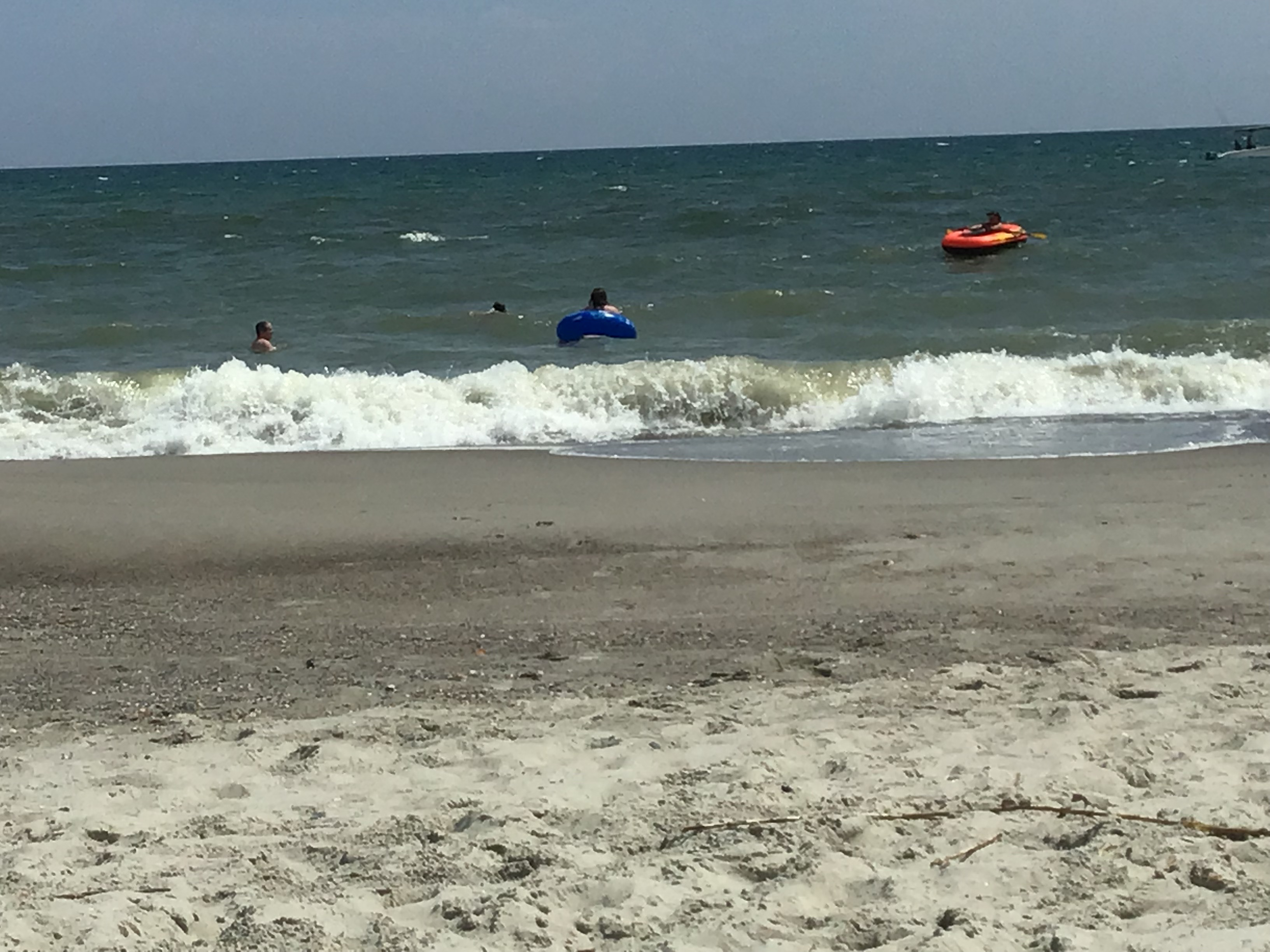 Jackson & Josh Curtis enjoy a boat and tubing at Oak Island NC        Location:  Sandpiper Cottage, Oak Island NC                                 Source:  Julane Crabtree                               Date: 25 Jul 2023