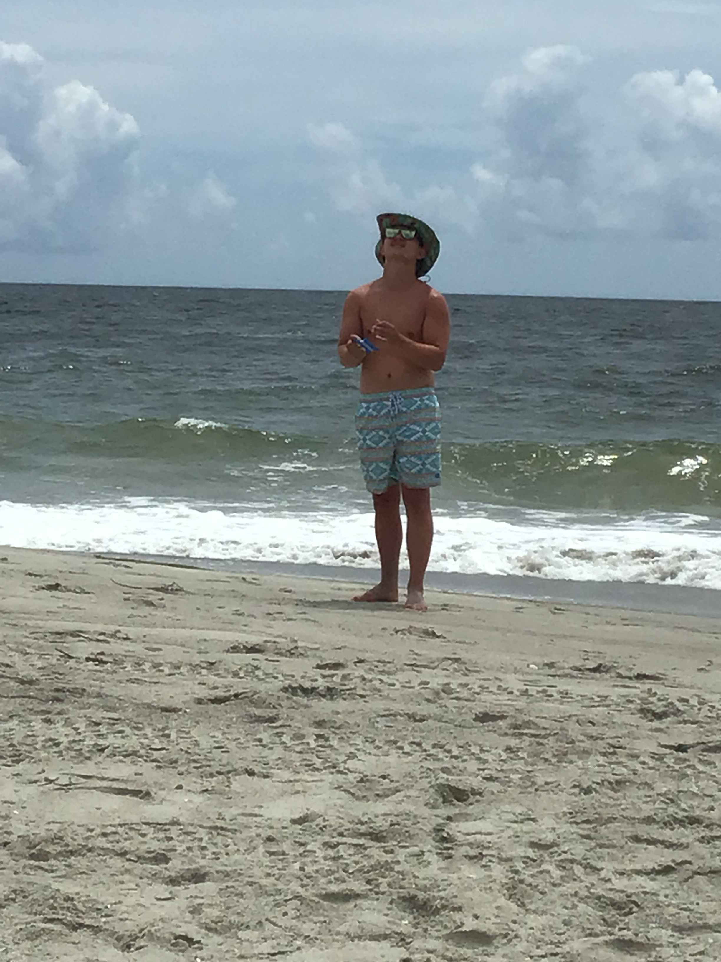 Jackson flies a kite.                      Location:  Sandpiper Cottage, Oak Island, NC                                 Source: Julane Crabtree                                Date: 28 Jul 2023