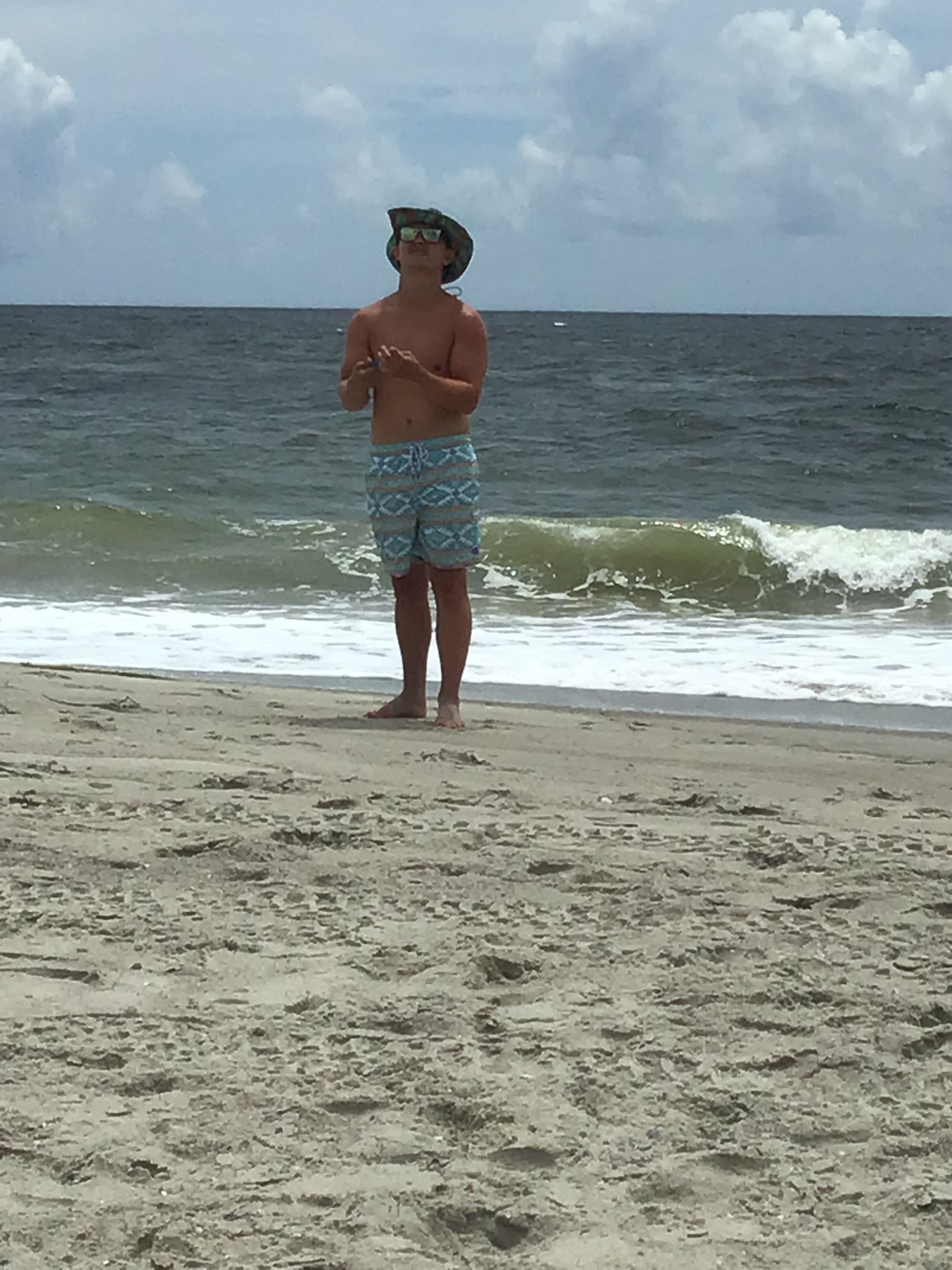Jackson flies a kite.                      Location:  Sandpiper Cottage, Oak Island, NC                                 Source: Julane Crabtree                                Date: 28 Jul 2023