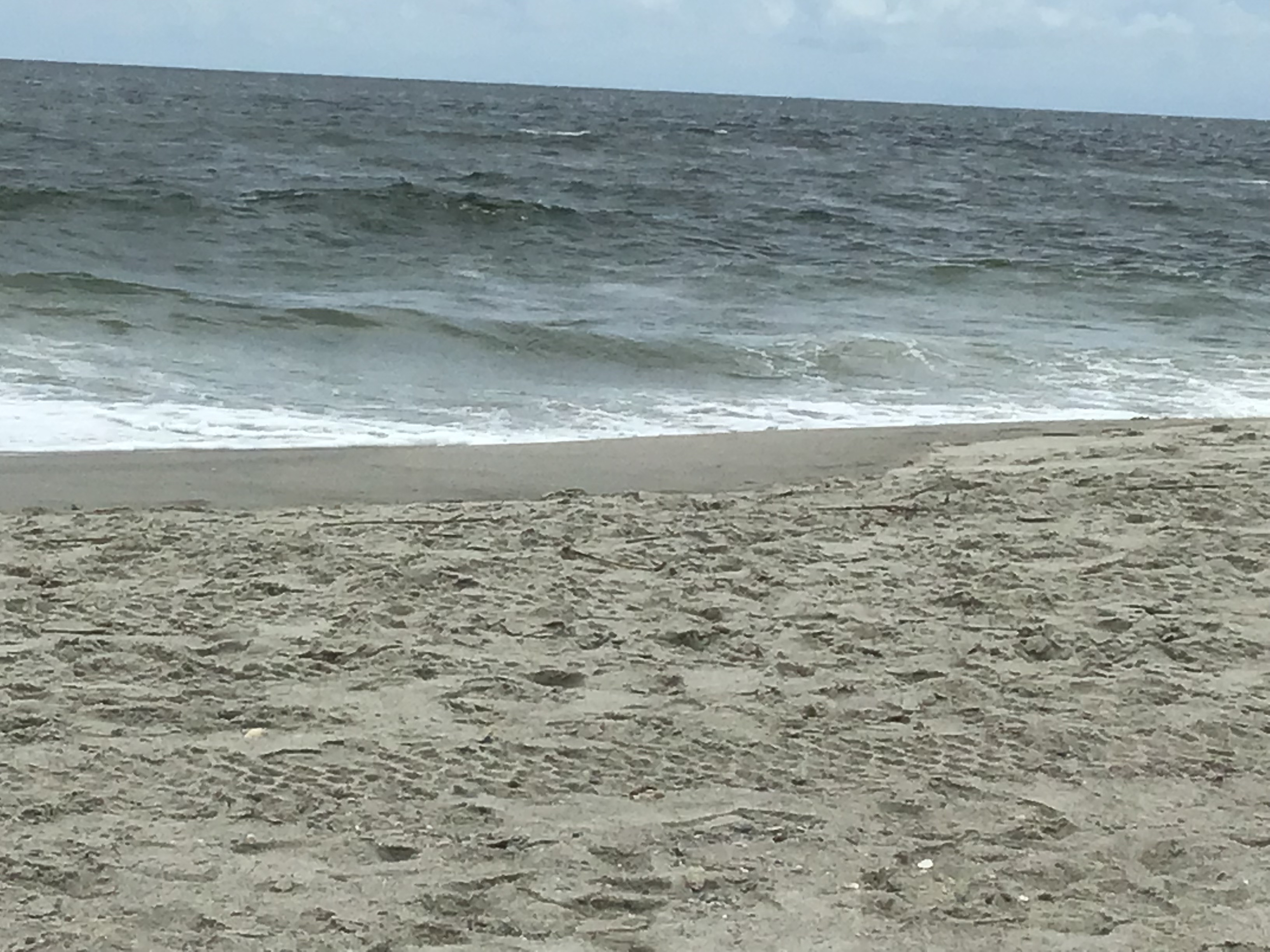 View of the Ocean - a very calm ocean for most of the week.          Location:  Sandpiper Cottage, Oak Island NC                                 Source:  Julane Crabatree                               Date:28 Jul 2023