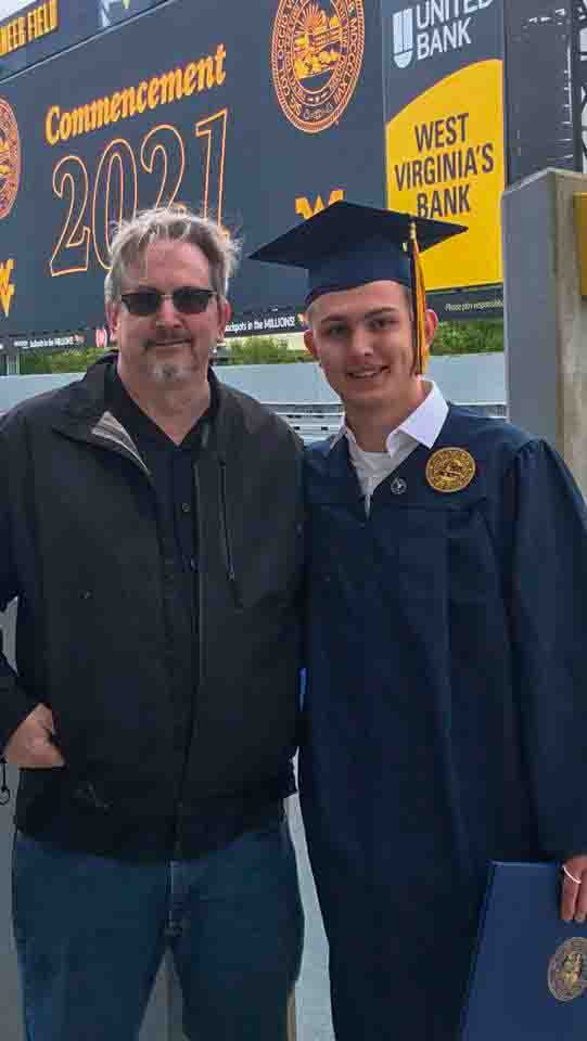 Jackson Bruner Curtis graduates from WVU in the midst of Covid-19!  Finally picks up his diploma in May 2021.  WIth his dad, Gene C Curtis II               Location:  Morgantown WV                       Source:  Odalie Curtis    Date:  16 May 2021